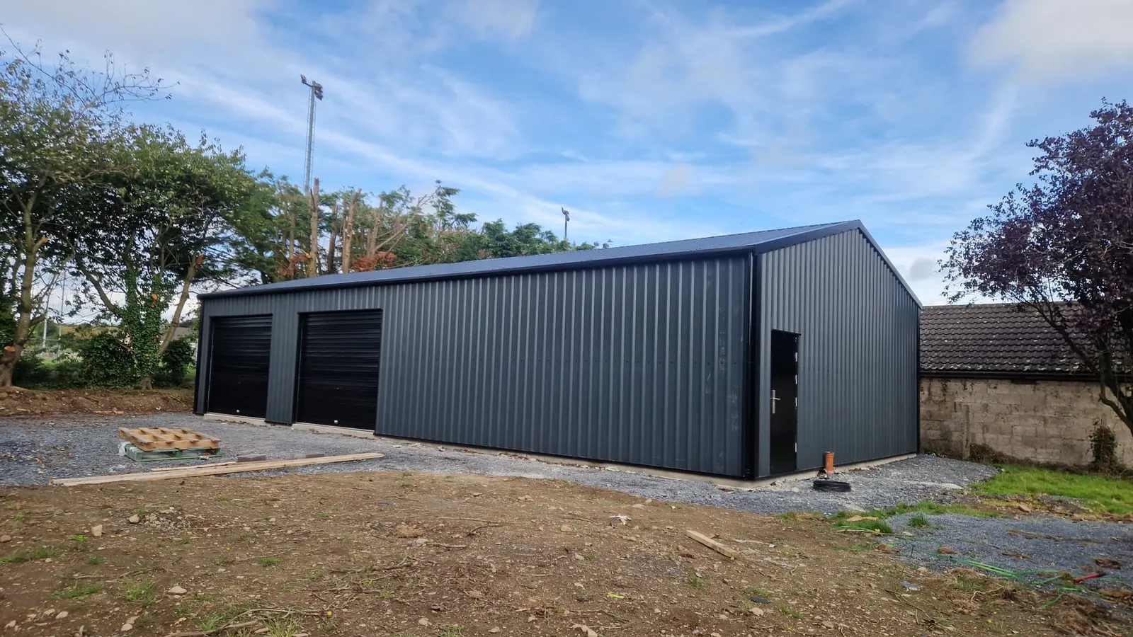 Grey steel double garage, side view
